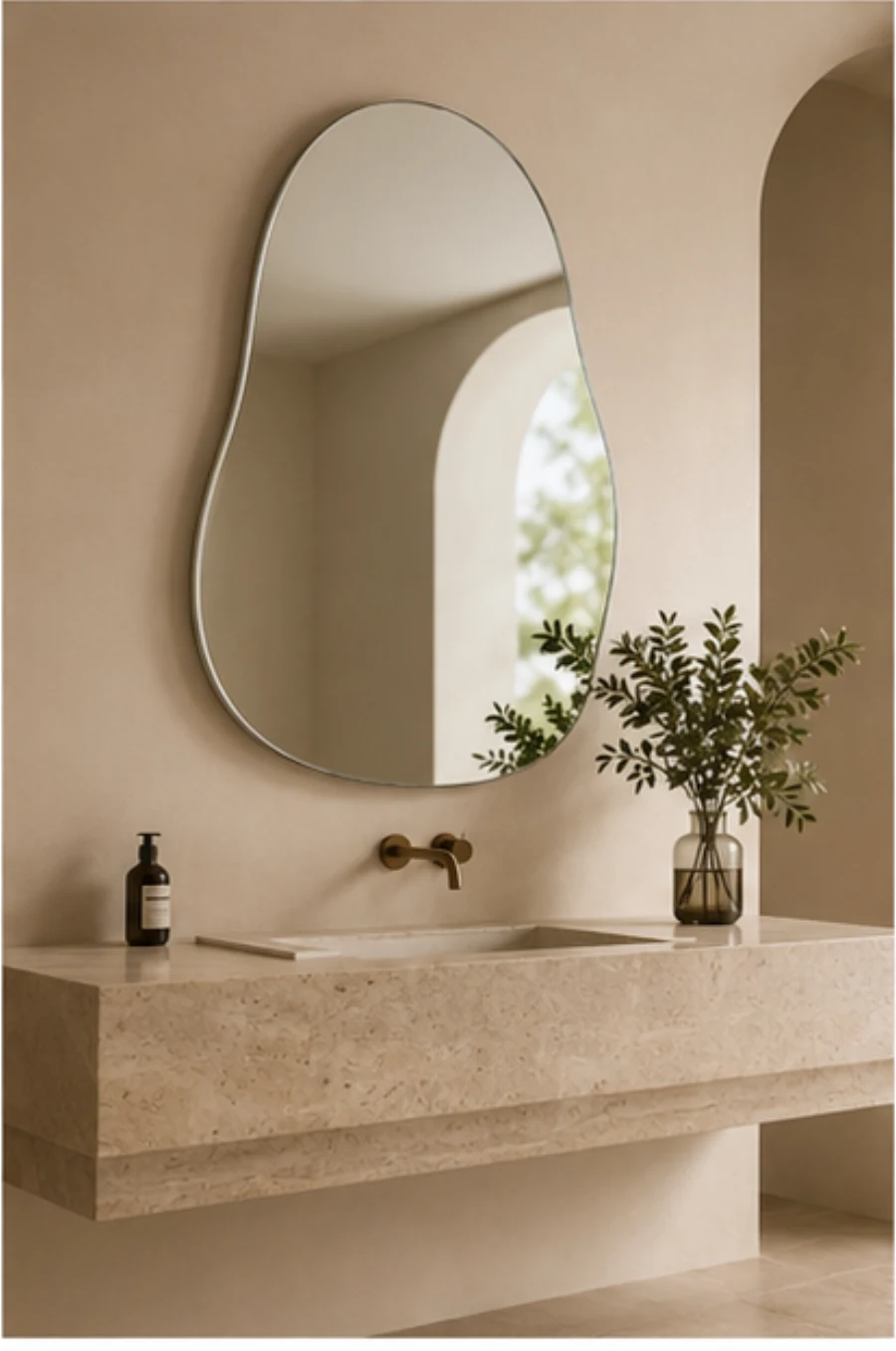 Frameless freeform mirror with a polished edge in a minimalist bathroom