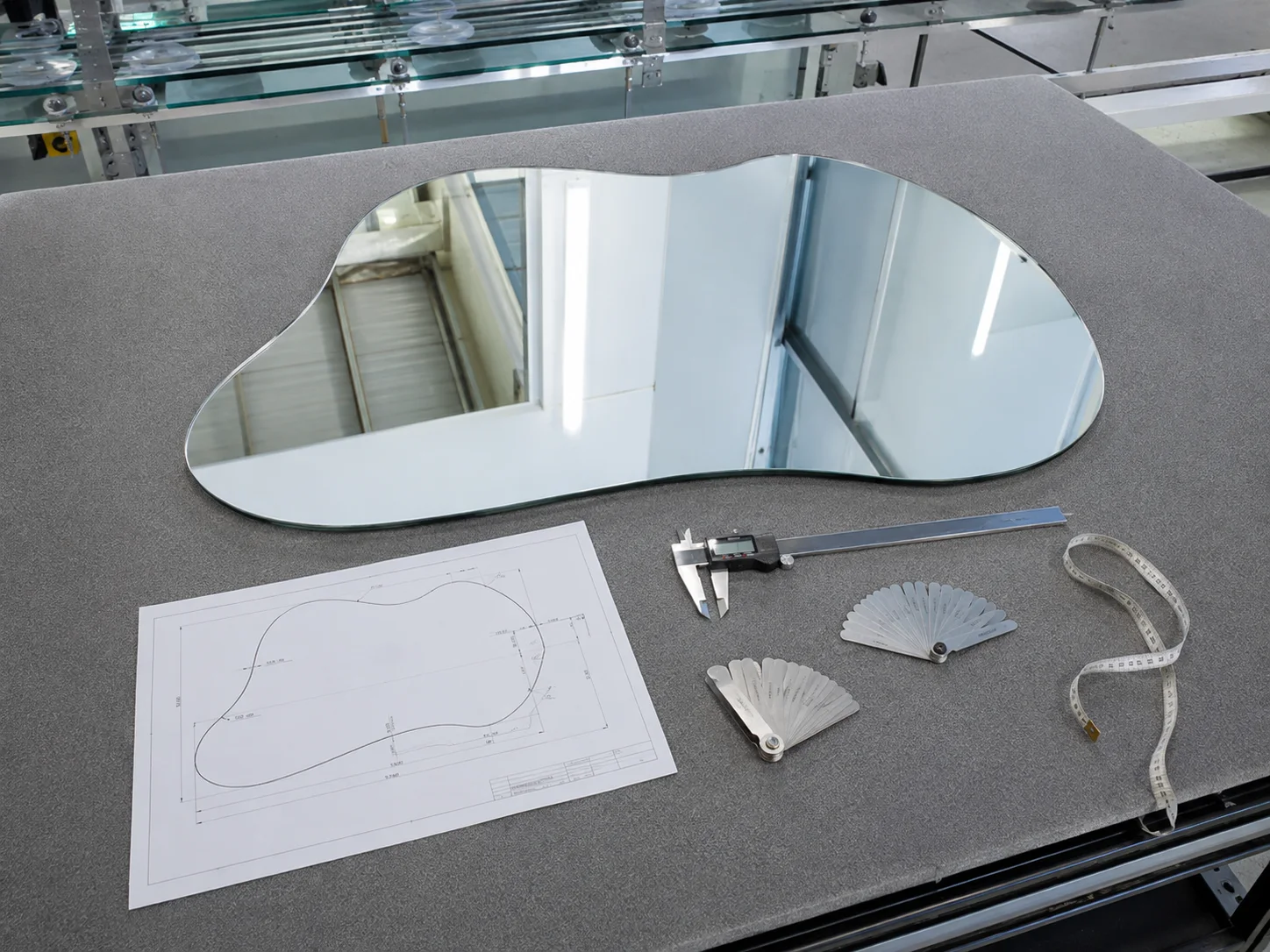 Irregular mirror, dimensioned drawing and inspection tools at a factory quality station