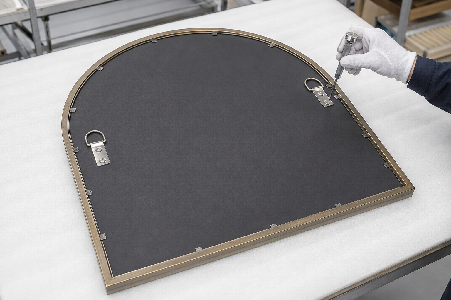 Rear assembly inspection of backing, perimeter retainers and symmetrical hanging brackets