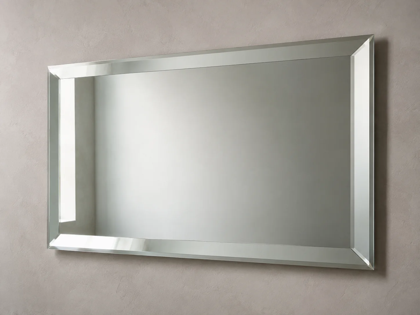 Close product view of a frameless mirror with a wide precision beveled perimeter