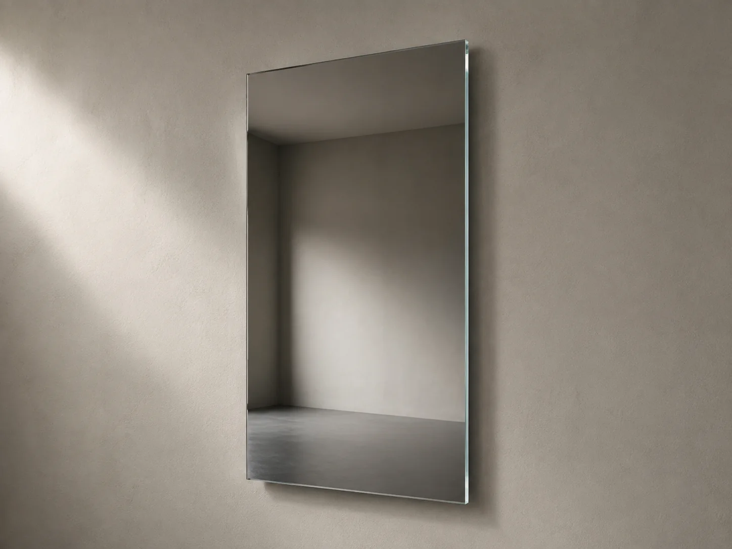 Close product view of a frameless mirror with a thin polished exposed glass edge
