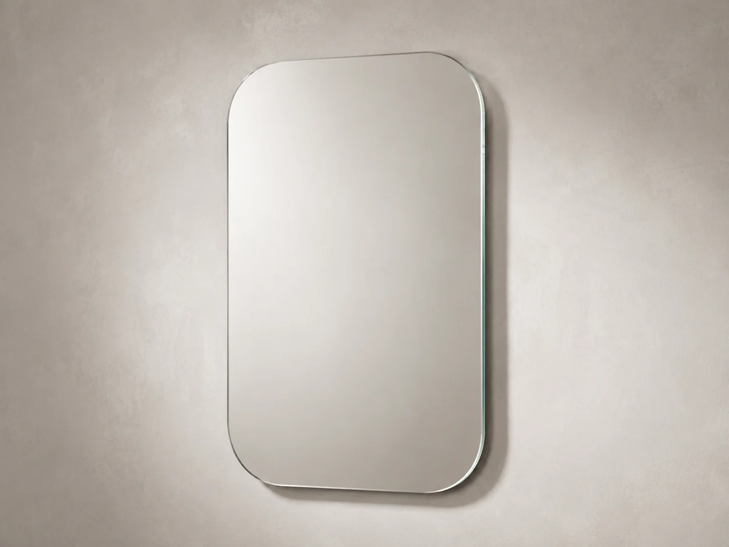 Custom soft-rectangle frameless mirror with large consistent corner radii