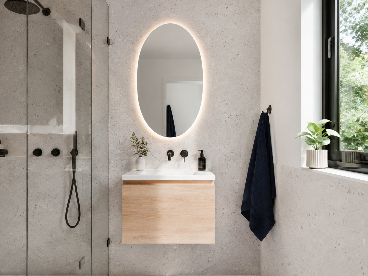 Oval mirror in apartment bathroom