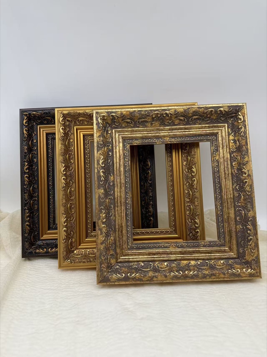 Physical ornate antique gold and dark decorative frame samples