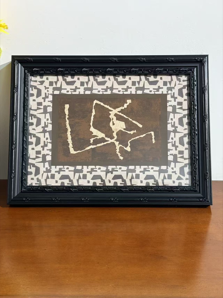Black ornamental frame assembly