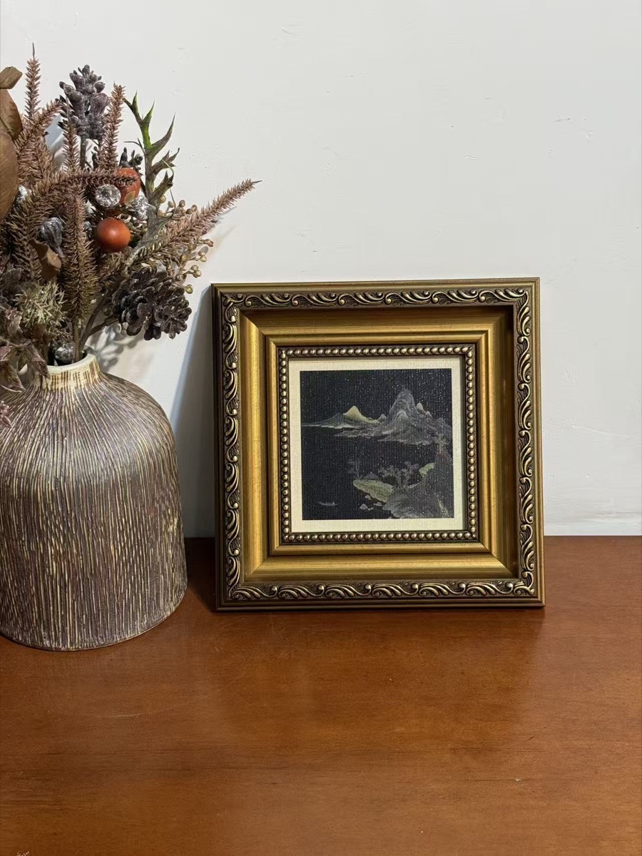 Antique gold ornate frame assembly