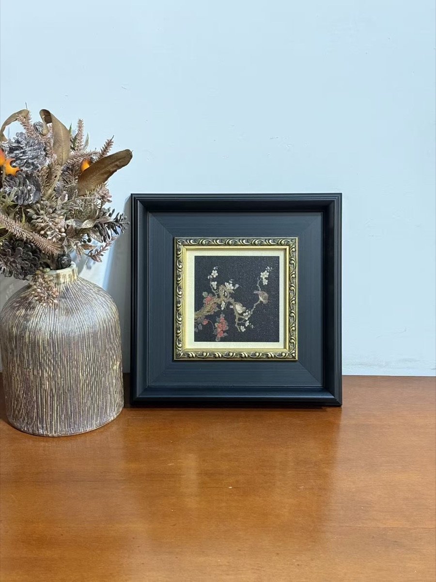 Black frame with gold ornamental inner trim
