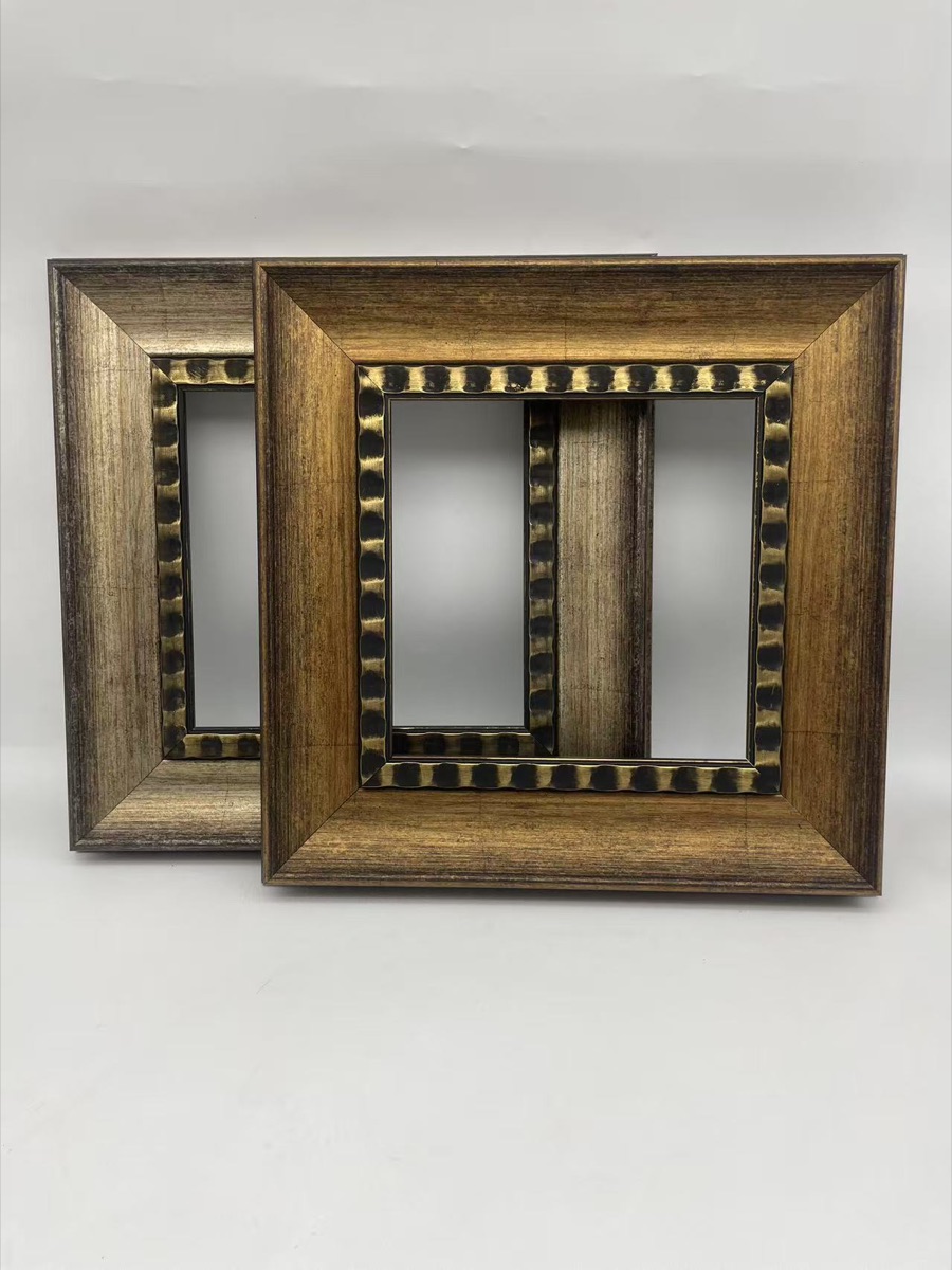 Broad gold bronze frame with dark inner edge